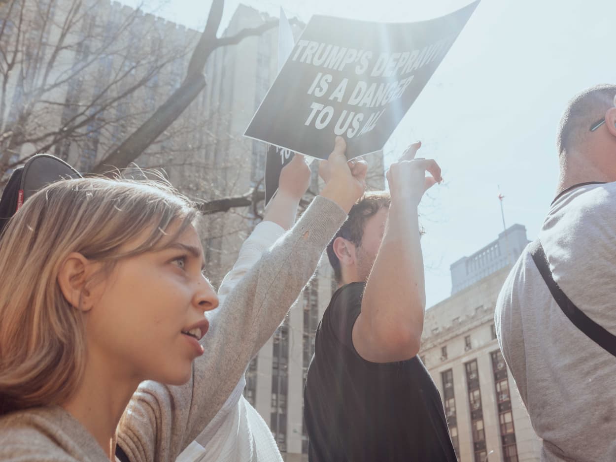 Protestors during a rally outside criminal court in New York, US, on Tuesday, April 4, 2023.