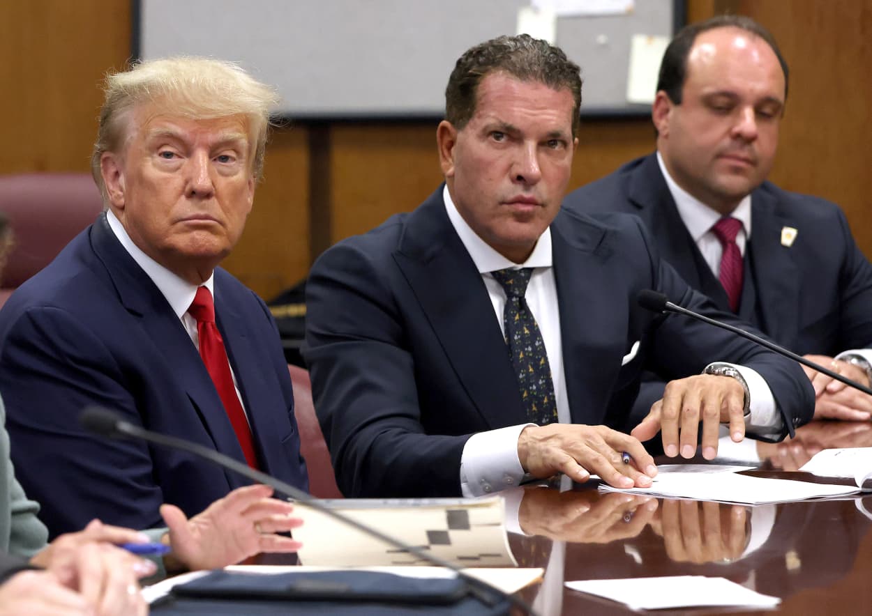 NEW YORK, NY - APRIL 04: Former U.S. President Donald Trump sits with his attorneys Joe Tacopina and Boris Epshteyn inside the courtroom during his arraignment at the Manhattan Criminal Court April 4, 2023 in New York City. Trump pleaded not guilty to 34 felony counts stemming from hush money payments made to adult film star Stormy Daniels before the 2016 presidential election. With his indictment, Trump will become the first former U.S. president in history to be charged with a criminal offense.