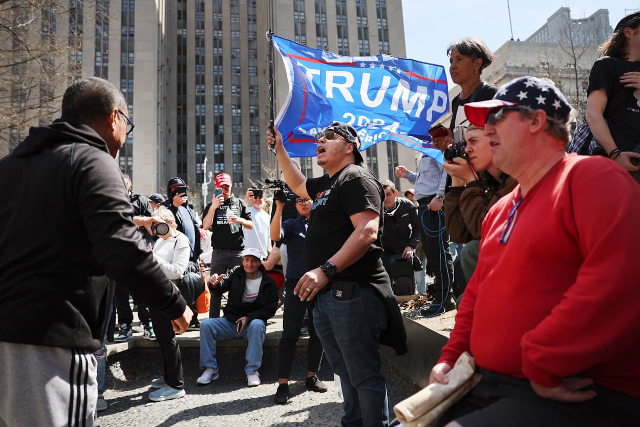Supporters and opponents of former President Donald Trump gather outside of the Manhattan Criminal Court during his arraignment on April 04, 2023 in New York City. Trump will be arraigned during his first court appearance today following an indictment by a grand jury that heard evidence about money paid to adult film star Stormy Daniels before the 2016 presidential election. With the indictment, Trump becomes the first former U.S. president in history to be charged with a criminal offense.