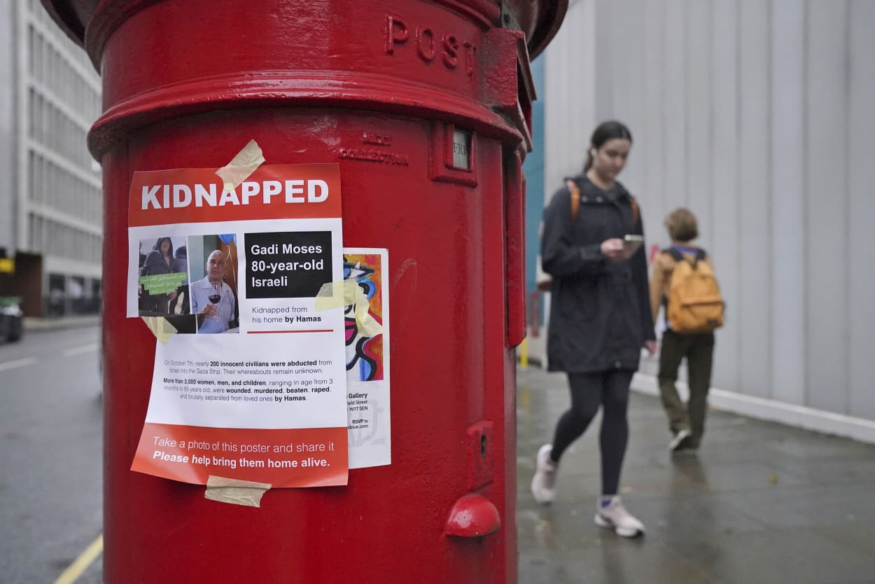 A poster on a mail box in London shows an Israeli man believed to be kidnapped by Hamas.