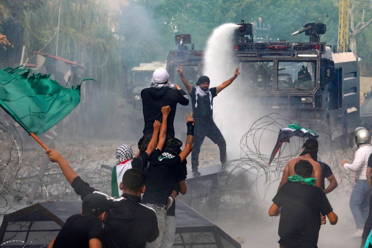 Lebanese security forces use water cannons as they clash with protesters supporting Palestinians outside the U.S. Embassy in Awkar, east of Beirut, on Oct. 18, 2023.