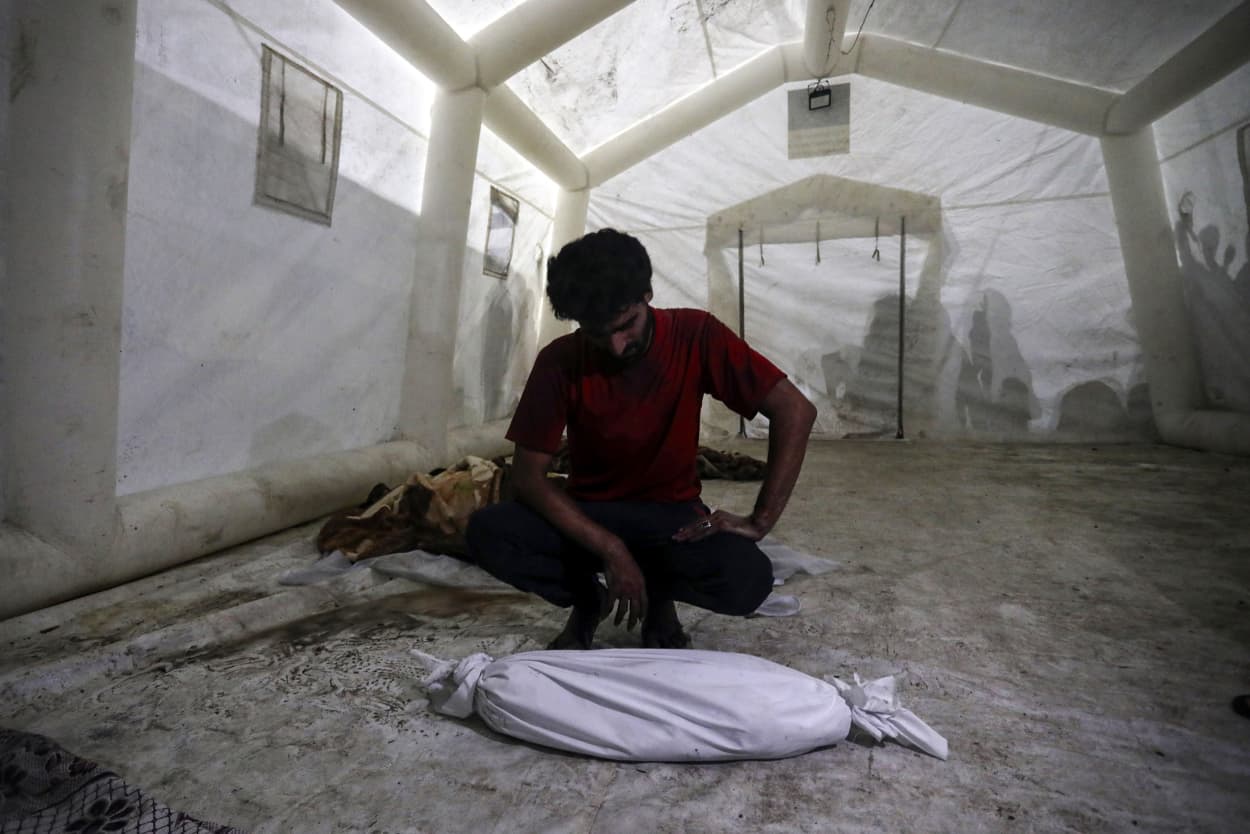 A man mourns the death of his child at the al-Shifa hospital in Gaza City.