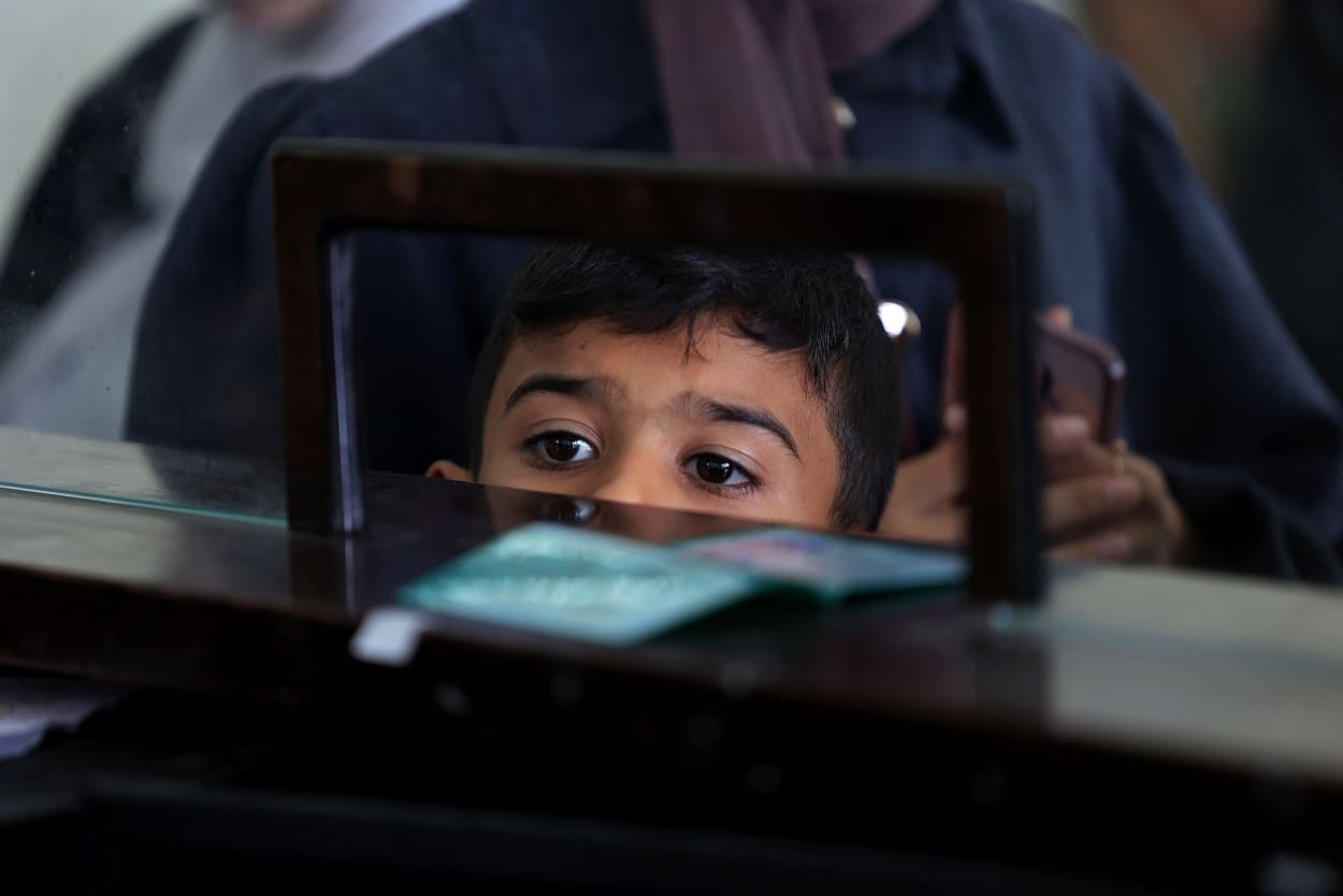 Palestinians at the border with Egypt at the Rafah crossing.