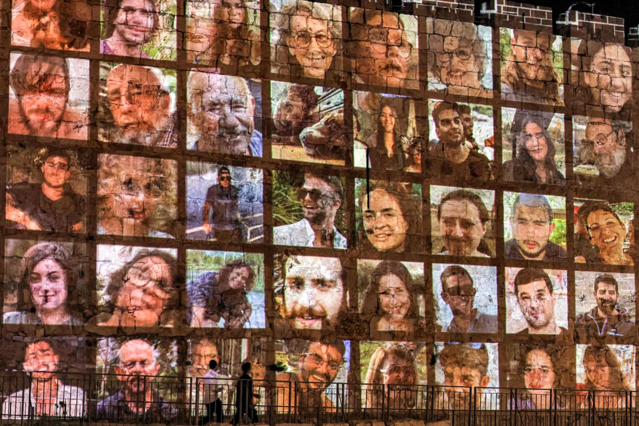 The faces of hostages currently held by Hamas are projected on the old city walls in Jerusalem.