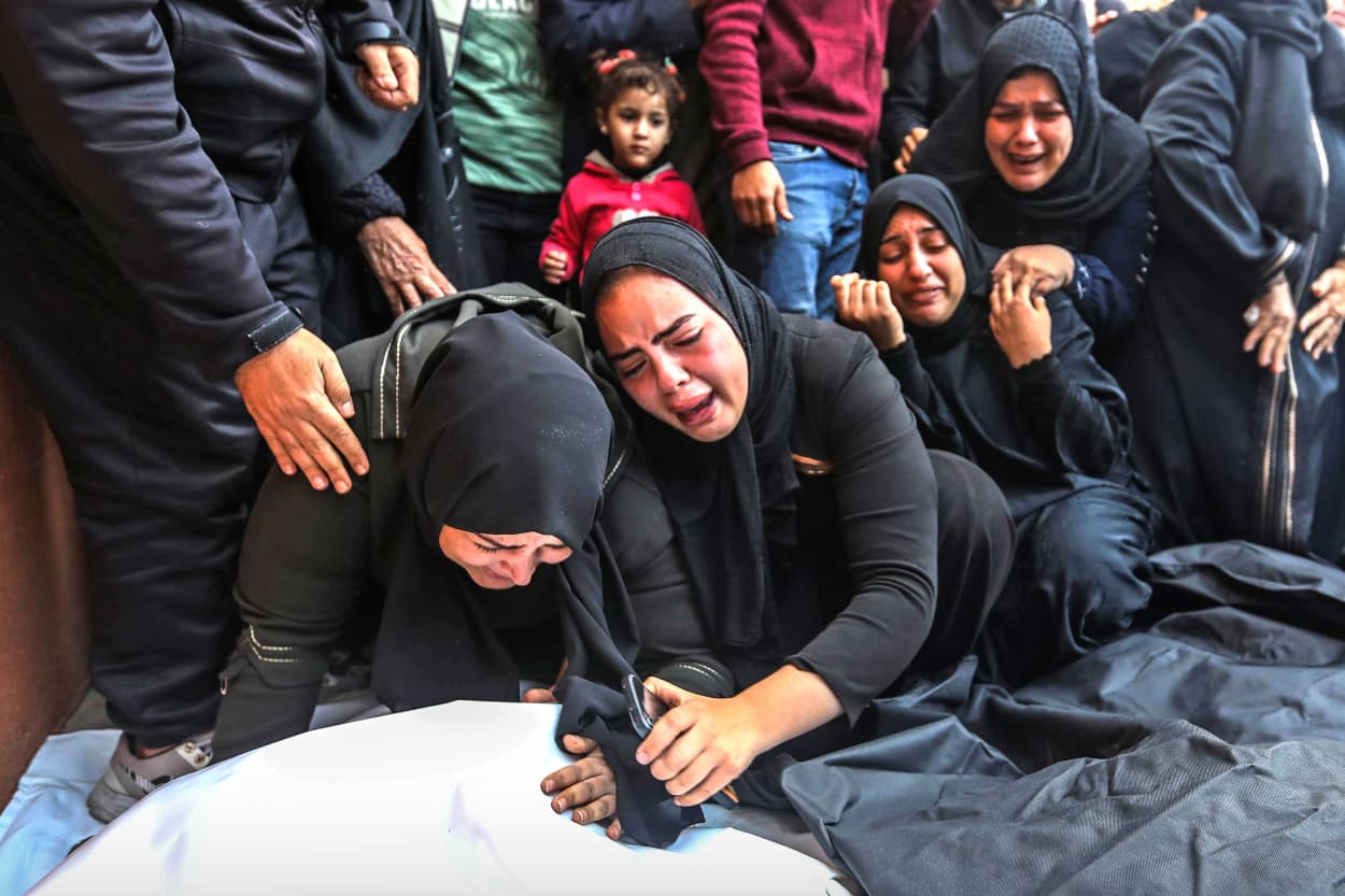 Mourners collect the bodies of loved ones on Dec. 20, 2023 in Khan Younis, Gaza.