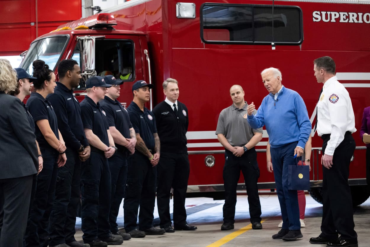 President Joe Biden visits with firefighters at the Superior Fire Department in Superior, Wis., on Jan. 25, 2024.