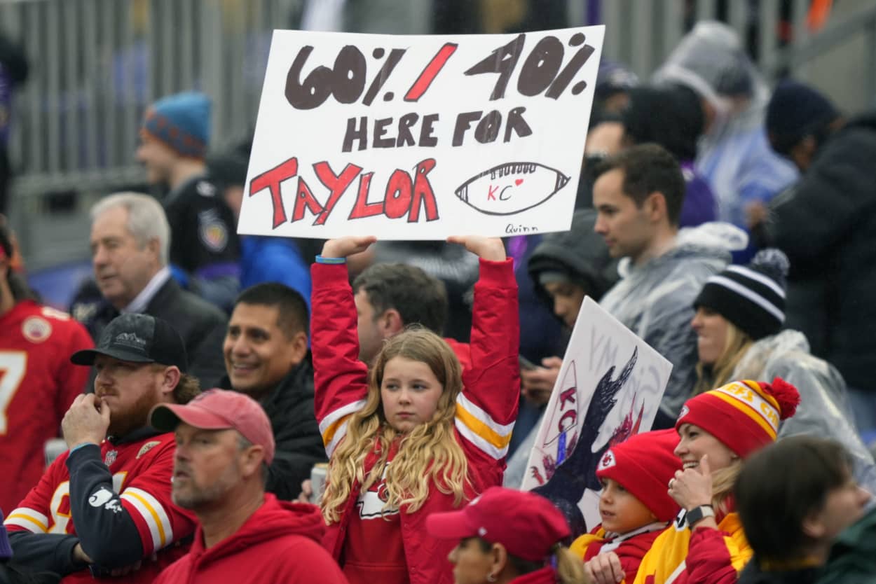 A fan holds a sign for Taylor Swift