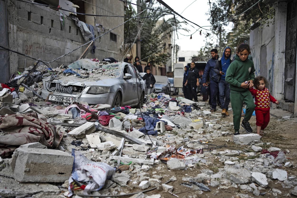 Palestinians look at the destruction after an Israeli airstrike in Rafah, Gaza, on Feb. 9, 2024.