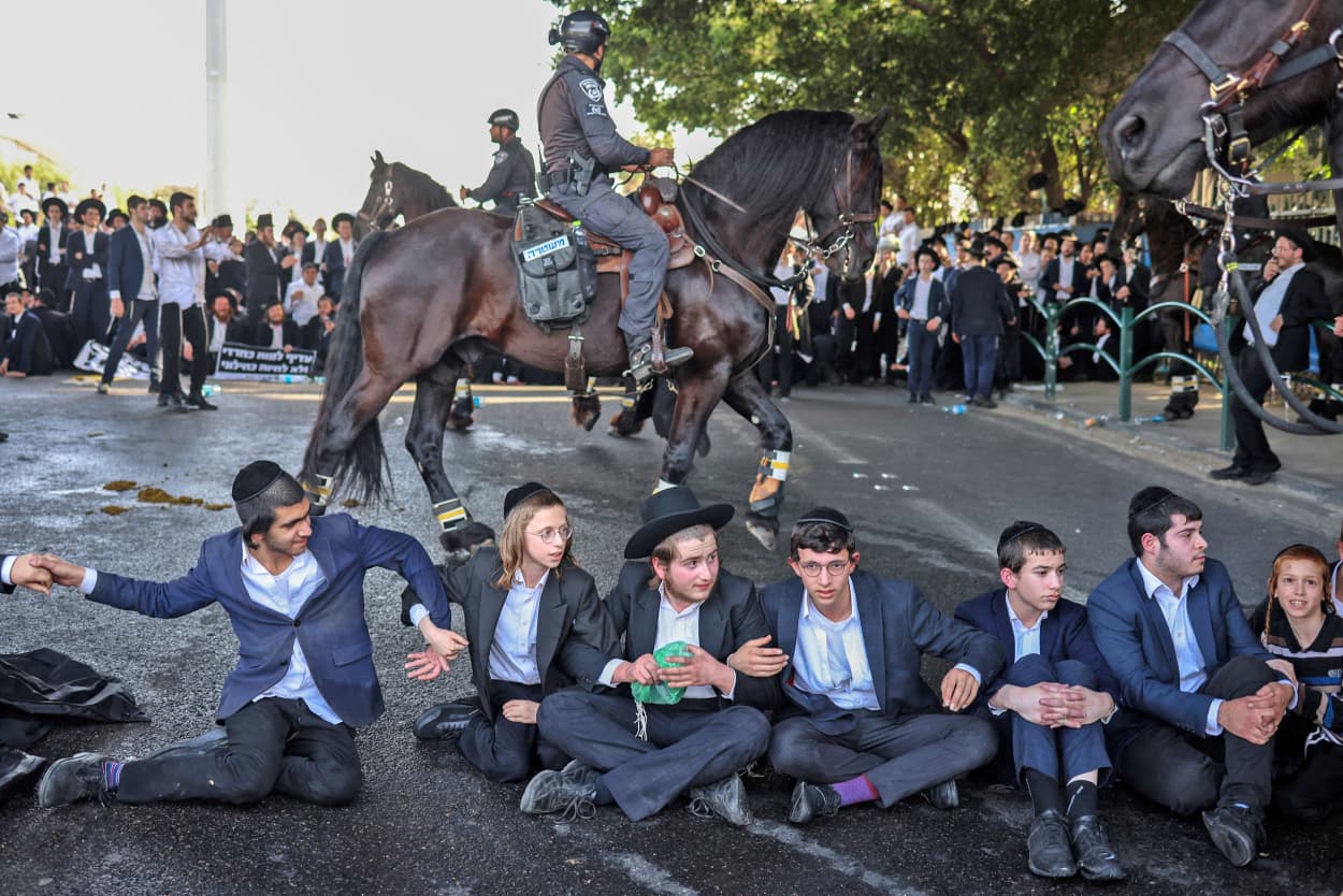 Ultra Orthodox Jews block a highway in Bnei Brak as they protest against their conscription into the Israeli armed forces on April 1, 2024. 