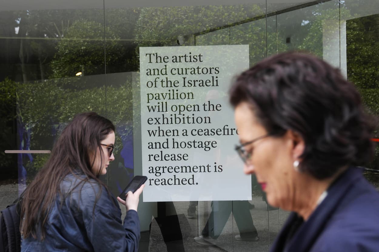The sign announces that the artist and curators representing Israel at this year's Venice Biennale won't open the Israeli pavilion until there is a cease-fire in Gaza and an agreement to release hostages taken Oct. 7.