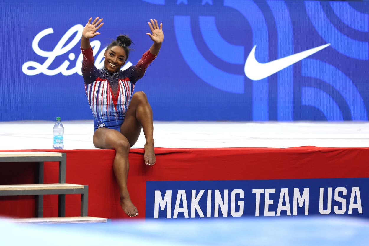 Simone Biles waves to fans on the final night of the 2024 U.S. Olympic Team Gymnastics Trials.