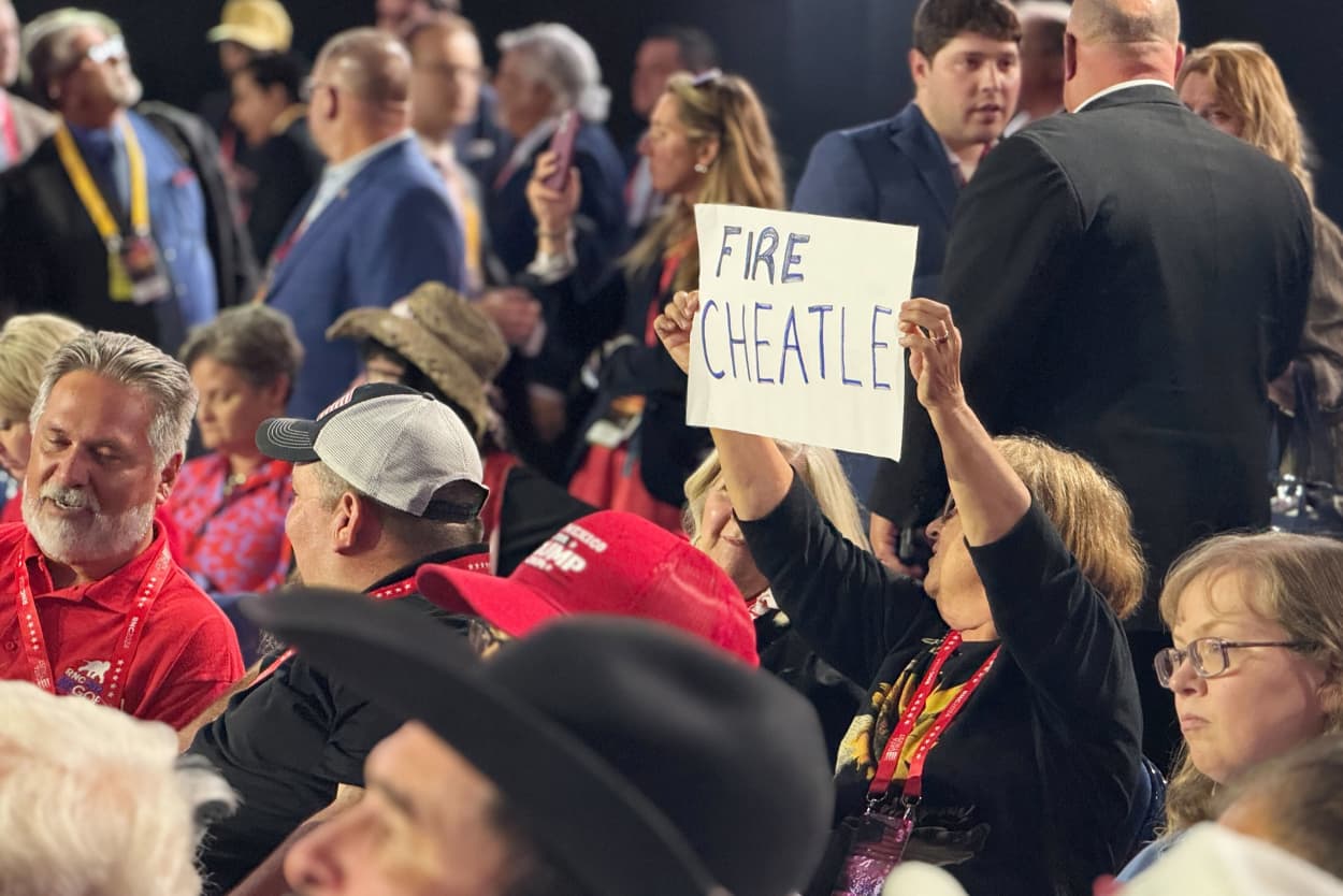 A delegate holds up a sign saying "Frie Cheatle" at the Republican National Convention on July 17, 2024.