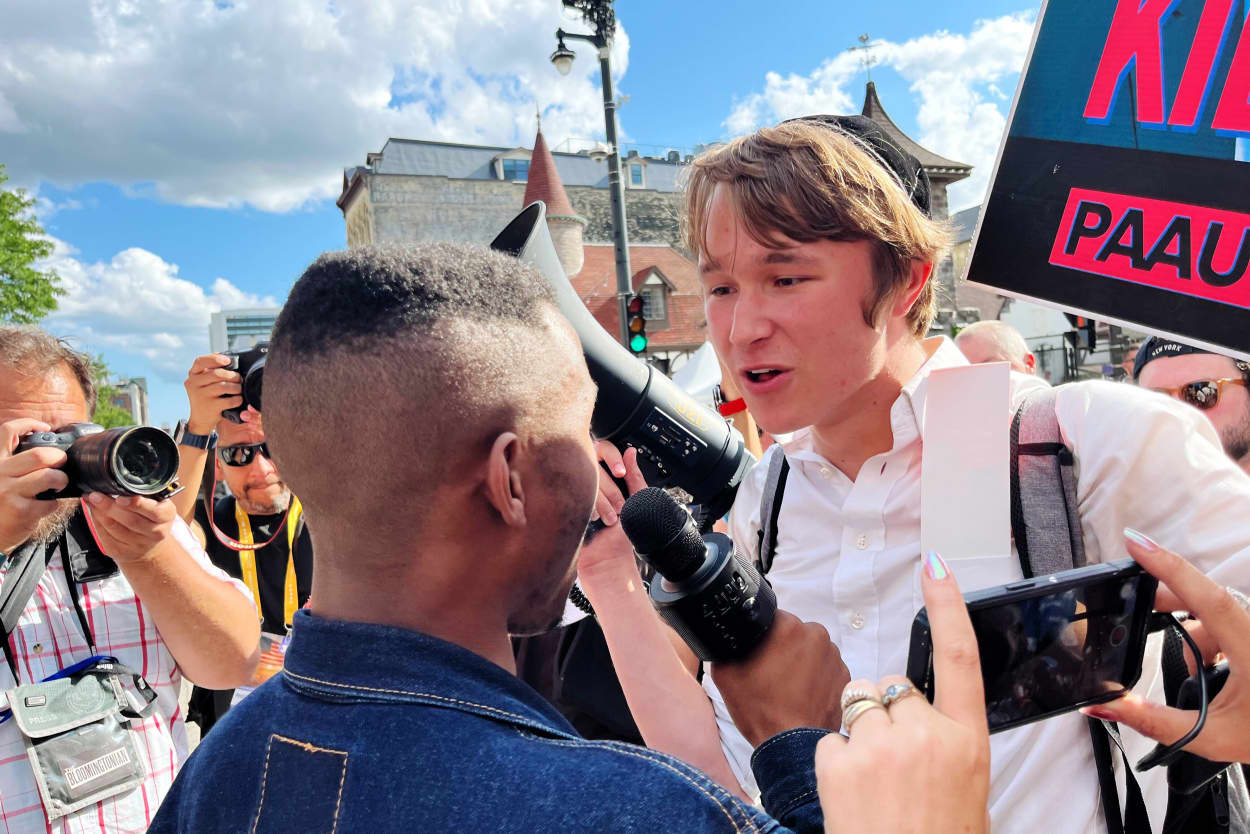 Protesters shout at each other outside the Republican National Convention in Milwaukee on July 17, 2024.