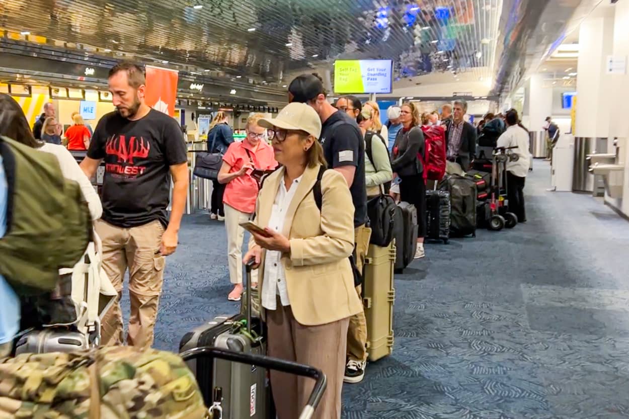 People in line at the airport check-in area.