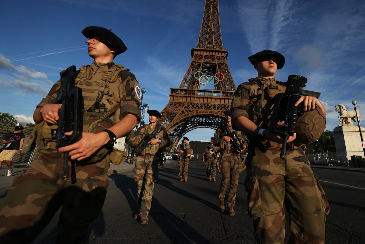 French soldiers patrol near to Eiffel Tower in Paris on July 21, 2024, ahead of the Paris 2024 Olympic and Paralympic Games.