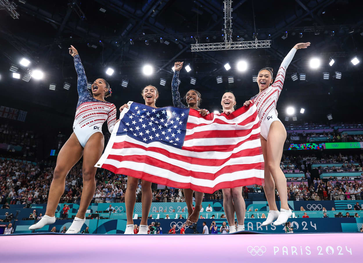 Image: Team United States celebrate winning the gold medal during the Artistic Gymnastics Women's Team Final