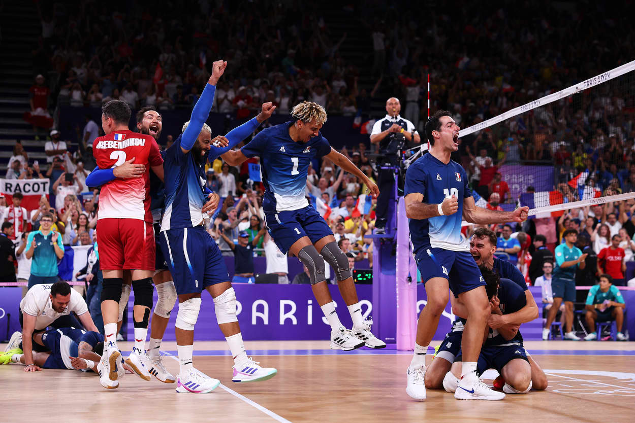 France's men's volleyball team celebrate winning the Gold medal at the Paris 2024 Olympic Games at Paris Arena on August 10, 2024 in Paris, France.