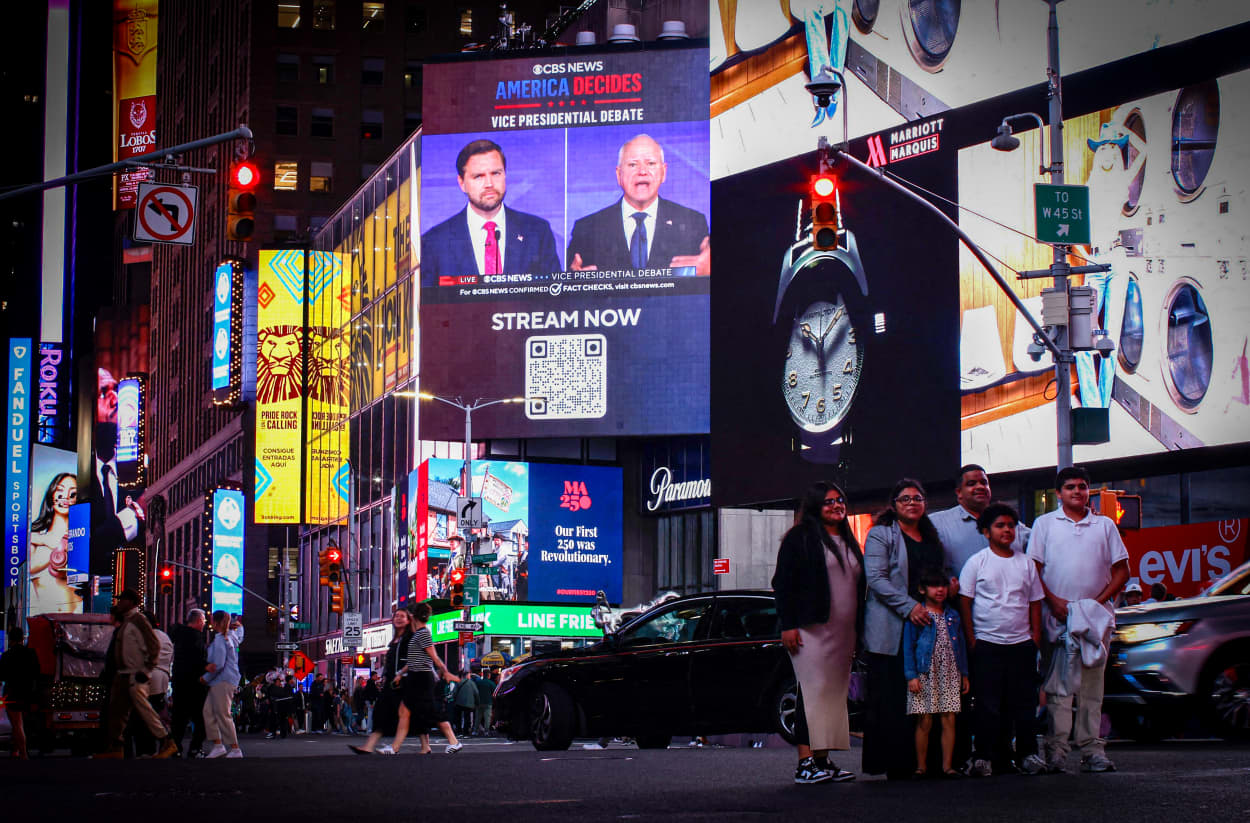 A screen display the CBS vice presidential debate in Times Square.