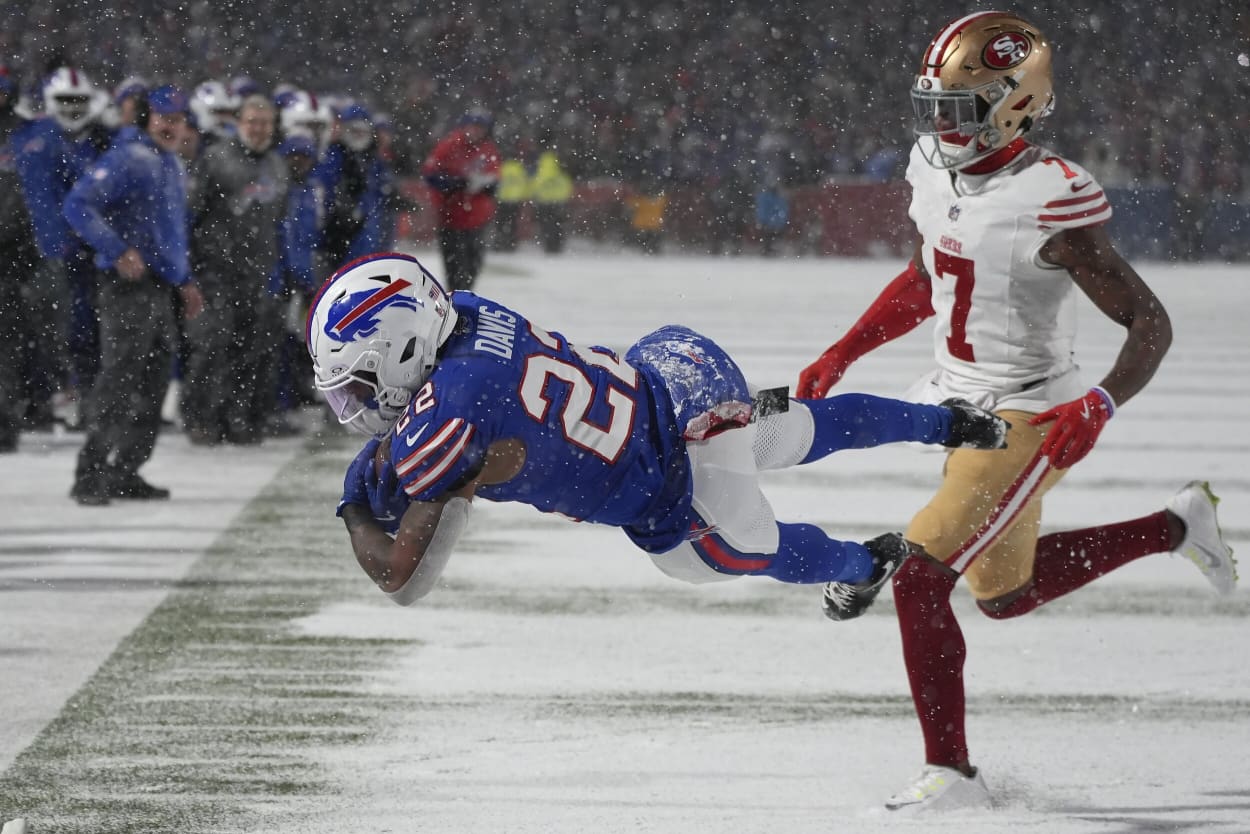 Buffalo Bills running back Ray Davis dives toward the end zone to score past San Francisco 49ers cornerback Charvarius Ward.