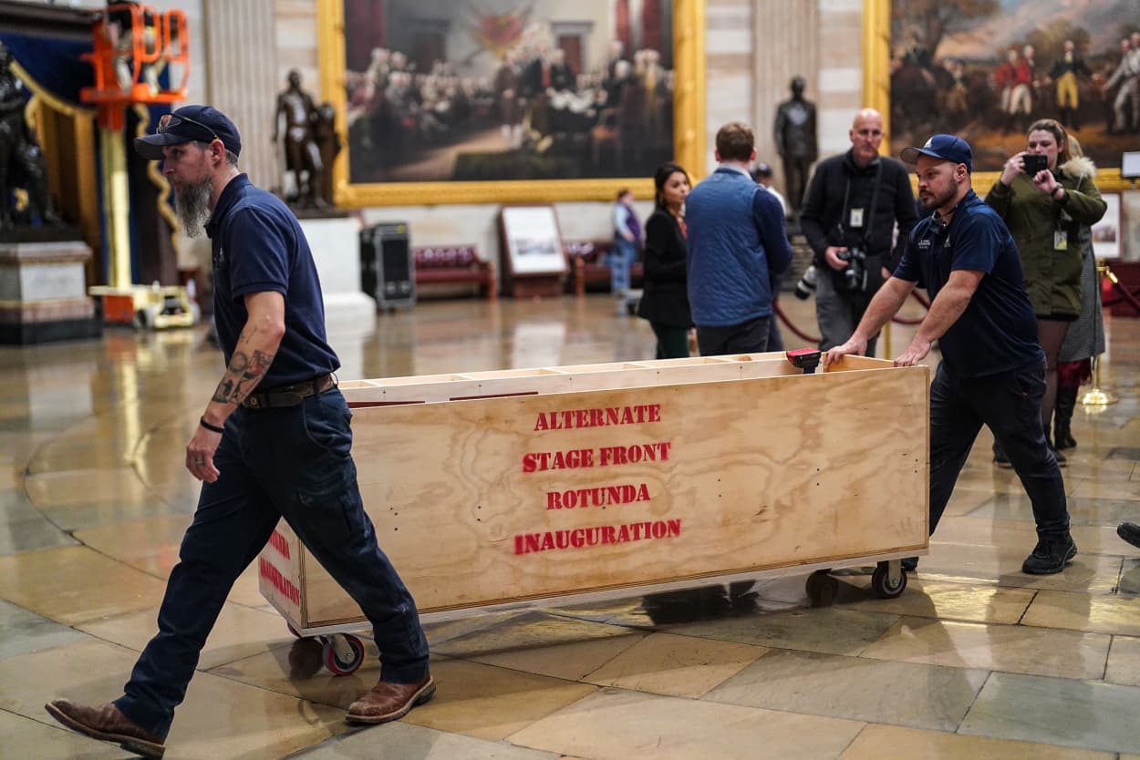 Workers for the Architect of the Capitol unload part of the alternate stage for President Elect Donald Trump’s inauguration, which will now take place into the Capitol