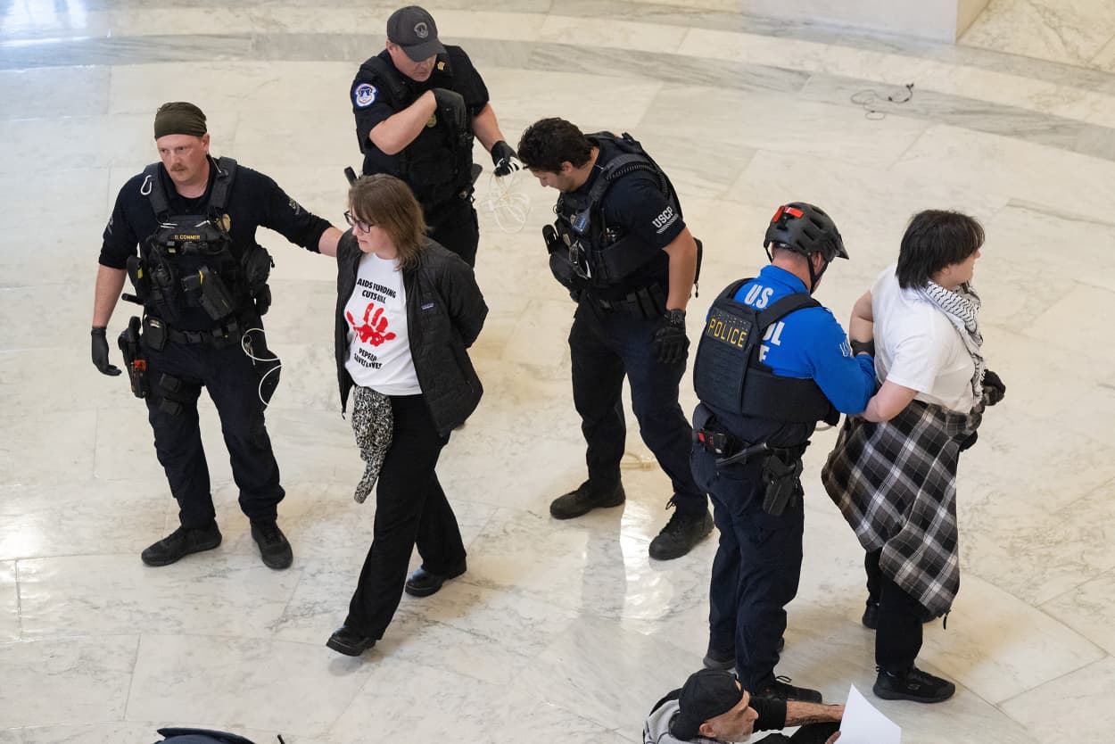 Capitol Police detain demonstrators protesting against cuts to AIDS funding and PEPFAR on Capitol Hill on Feb. 26, 2025. 