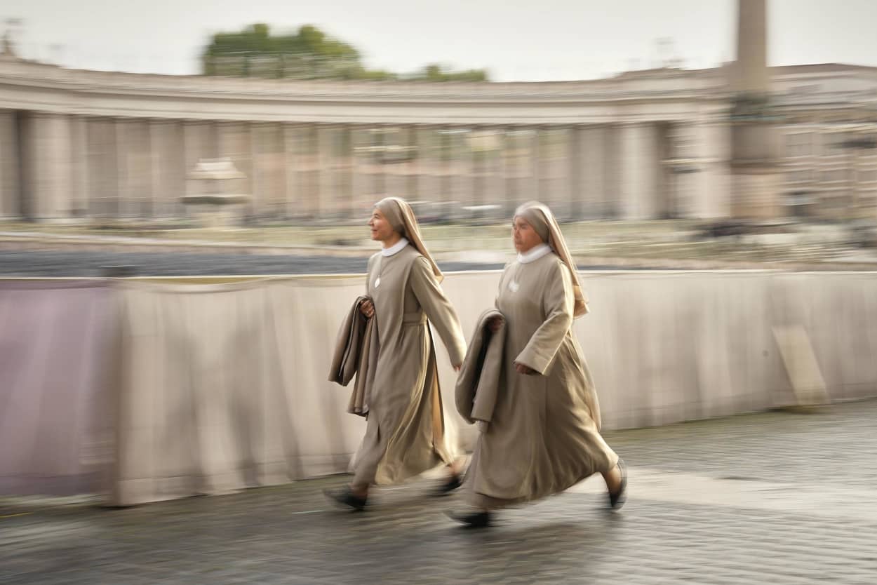 Nuns arrive in St. Peter's Square as they await the arrival of the body of Pope Francis, who will lie in state at St. Peter's Basilica for three days, at the Vatican, Wednesday, April 23, 2025. 