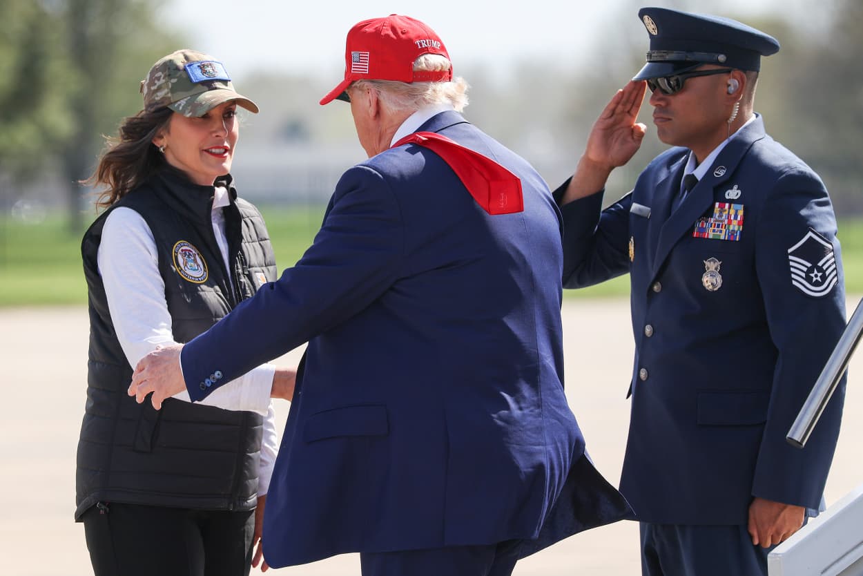 Michigan Gov. Gretchen Whitmer greets President Donald Trump