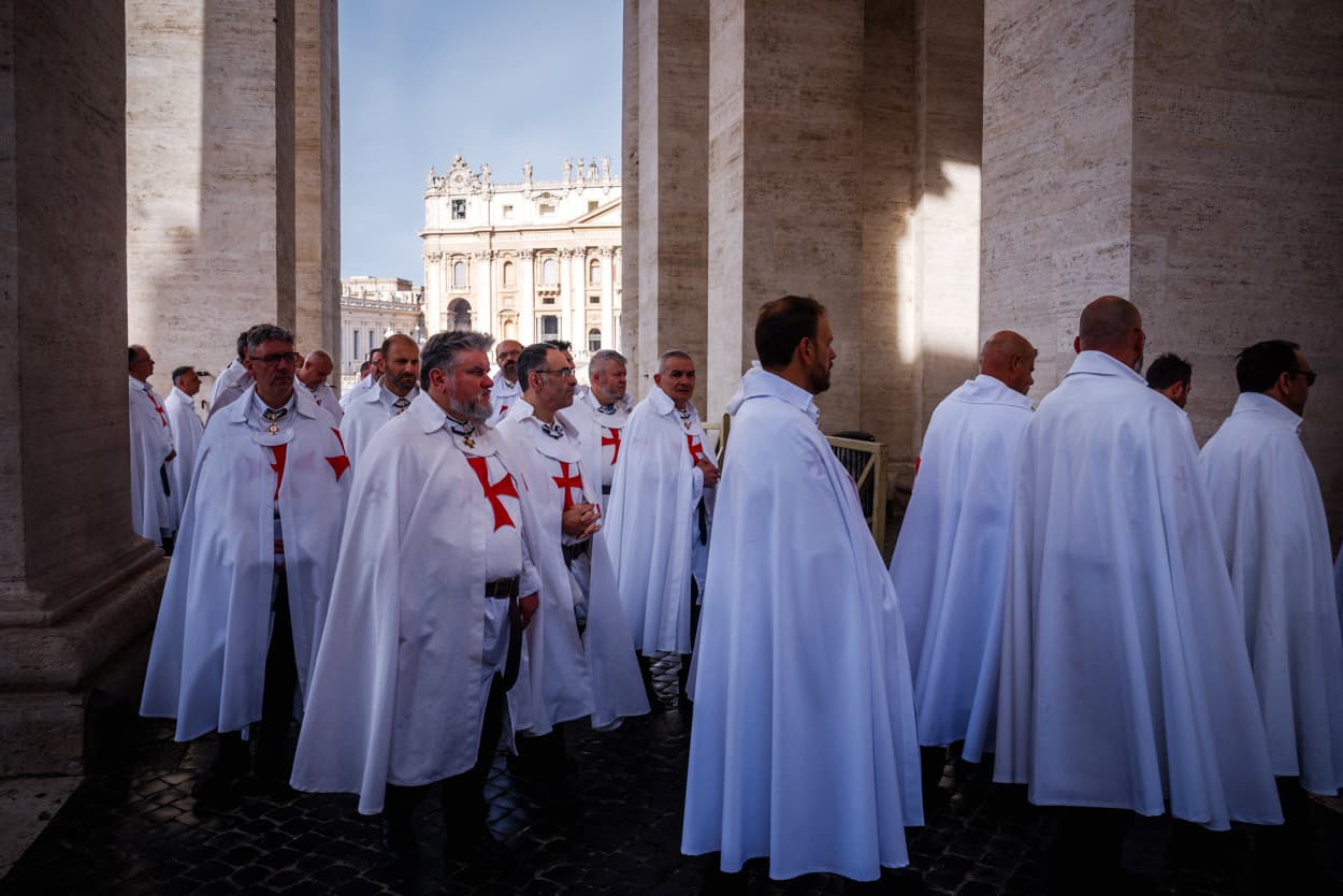 Members of Knights Templars walk in procession to the holy door of St Peter's basilica