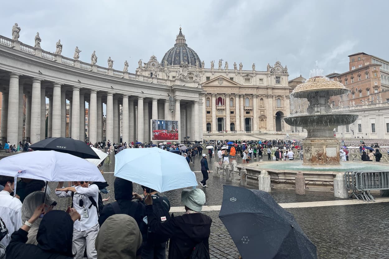 Those with umbrellas have put them up; those without were sent scurrying for shelter under the 284 colonnades that flank the square, built from marble and travertine by architect Gian Lorenzo Bernini in the 17th century.
