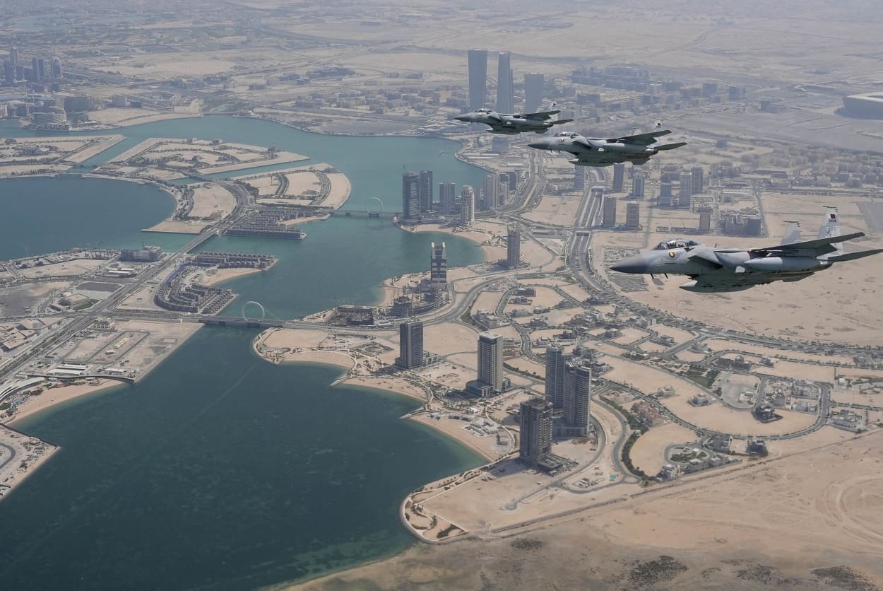 Qatar Emiri Air Force F-15s provide an honorary escort for Air Force One