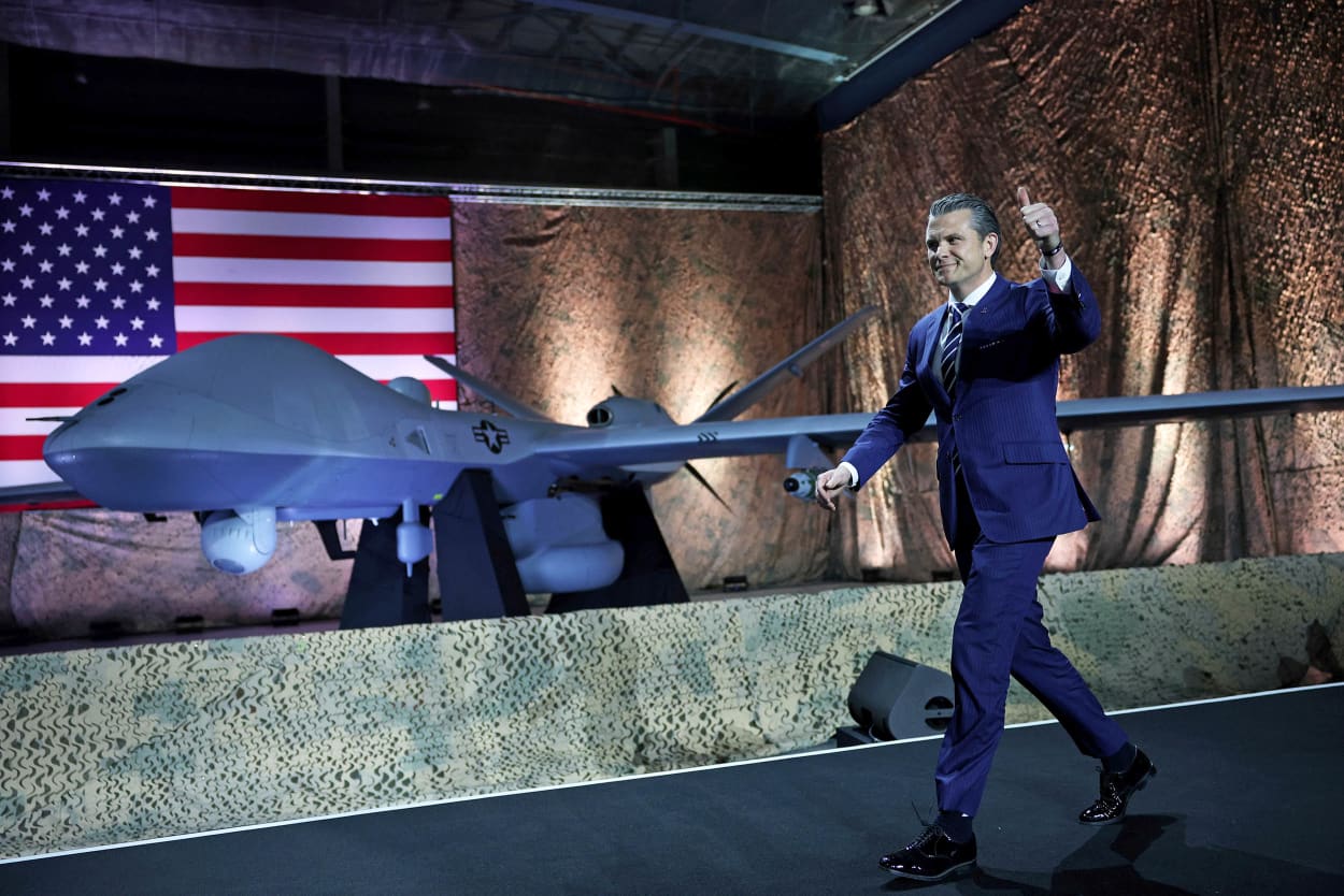 Secretary of Defense Pete Hegseth walks on the stage at the Al Udeid Air Base on May 15, 2025, in Doha, Qatar.