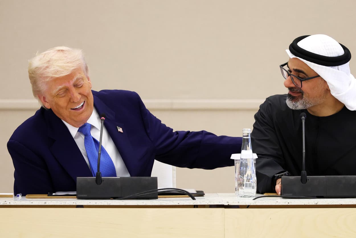 President Donald Trump and Crown Prince of Abu Dhabi Khaled bin Mohamed Al Nahyan laughing.