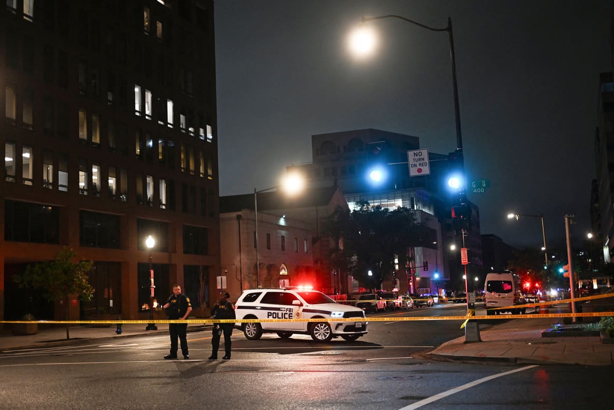 FBI agents cordon off the scene outside the Capital Jewish Museum