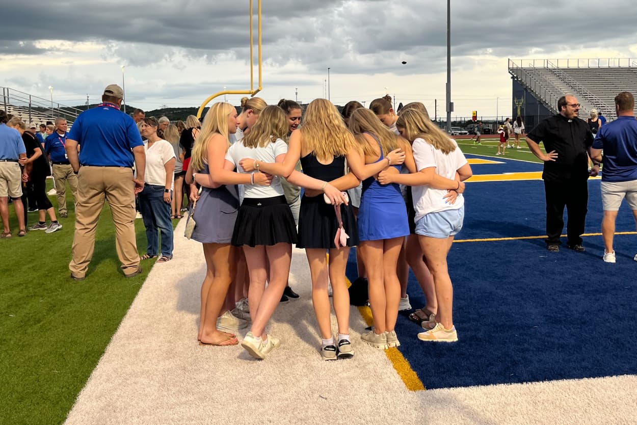 Mourners gathered at the Tivy High School football stadium Wednesday evening to honor those lost to the devastating floods in south-central Texas.