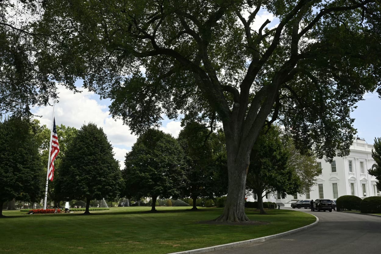 A large U.S. flag on the north lawn of the White House flies at half-staff on Aug. 27, 2025.
