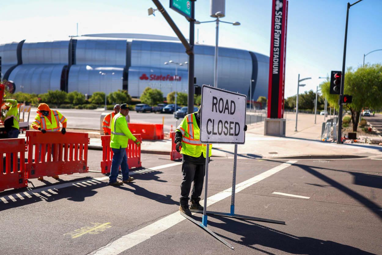 Workers outside of the stadium.