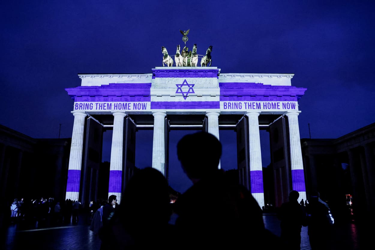 The Brandenburg Gate is lit up in Berlin