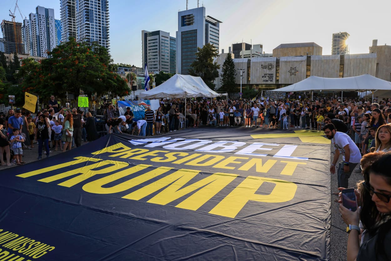 A giant banner which displays the words 'Nobel President Trump'.