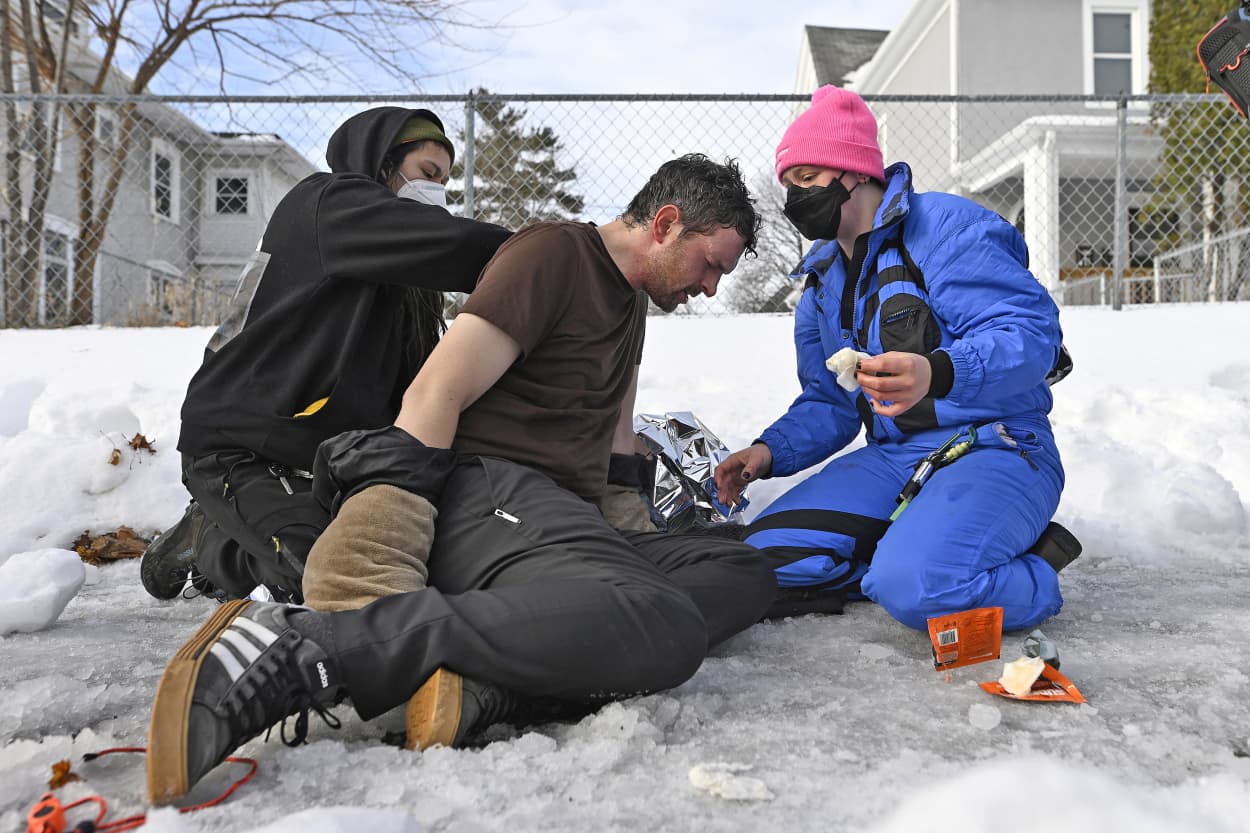 A man is treated after being exposed to a chemical irritant following a suspected shooting by an ICE agent during federal law enforcement operations on January 07, 2026 in Minneapolis, Minnesota.