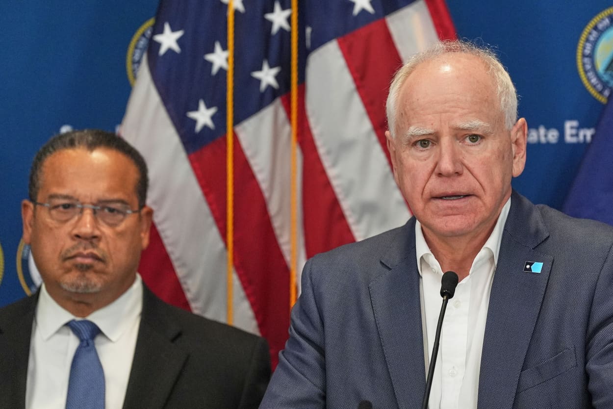 Minnesota Gov. Tim Walz, right, and Attorney General Keith Ellison discuss the shooting of Alex Pretti during a news conference in Blaine, Minn., Sunday, Jan. 25, 2026.