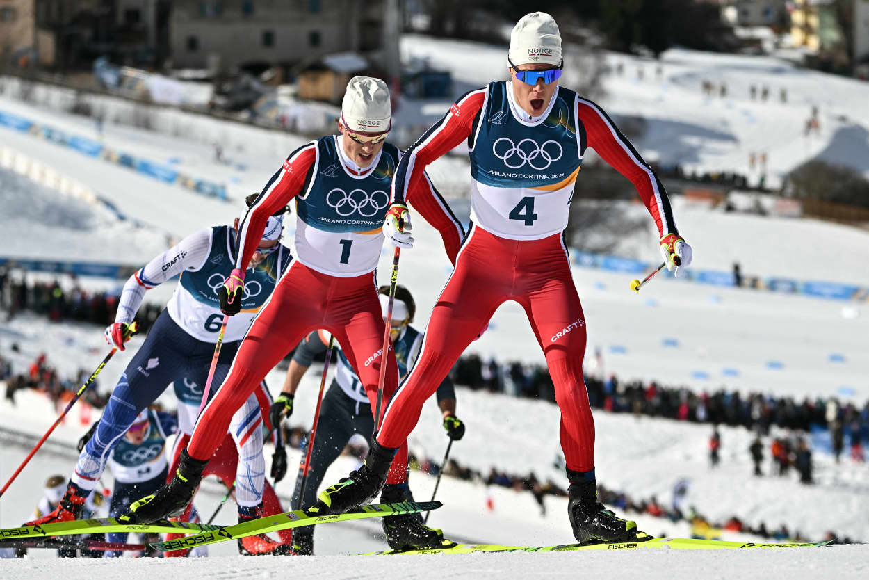 Norway's Martin Loewstroem Nyenget and Johannes Hoesflot Klaebo during the men's cross country 10km + 10km skiathlon in Lago di Teseroon Feb. 8, 2026.
