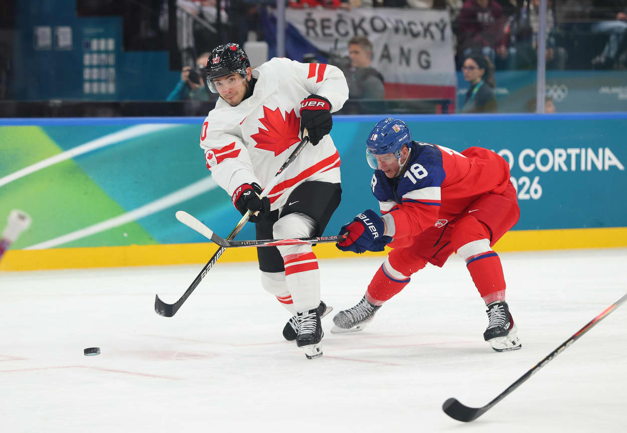 Nick Suzuki of Canada shoots the puck against Czechia at Milano Rho Ice Hockey Arena on February 12, 2026 in Milan.