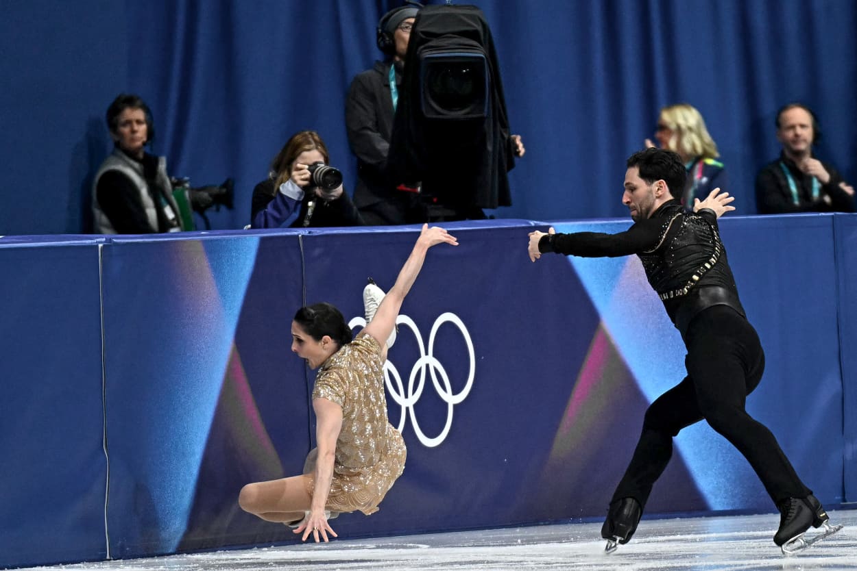 Deanna Stellato-Dudek cries out as she flies through the air toward the ice.