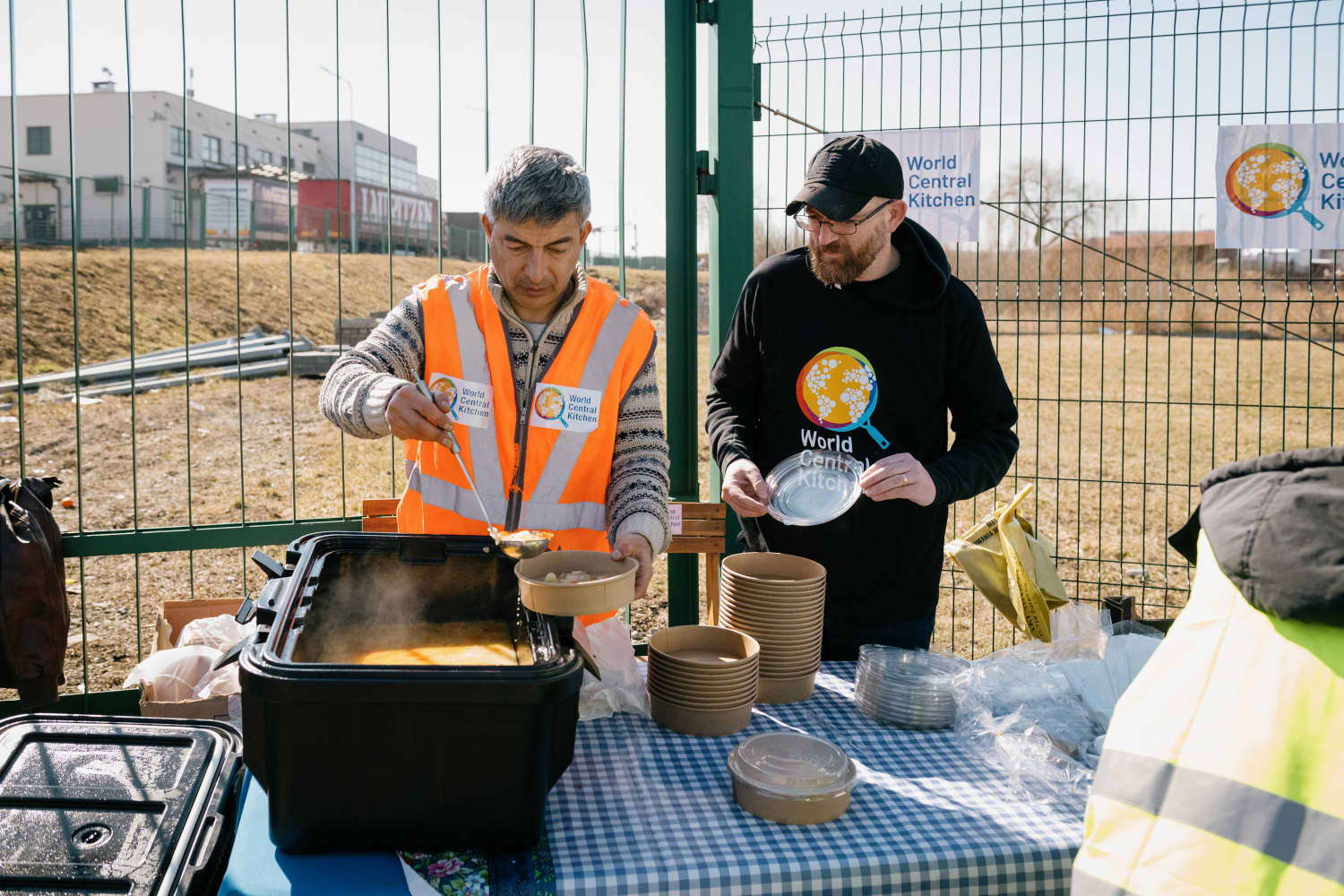 Image: Fara Shojaian, left, serves soup to Ukrainians crossing the border. 