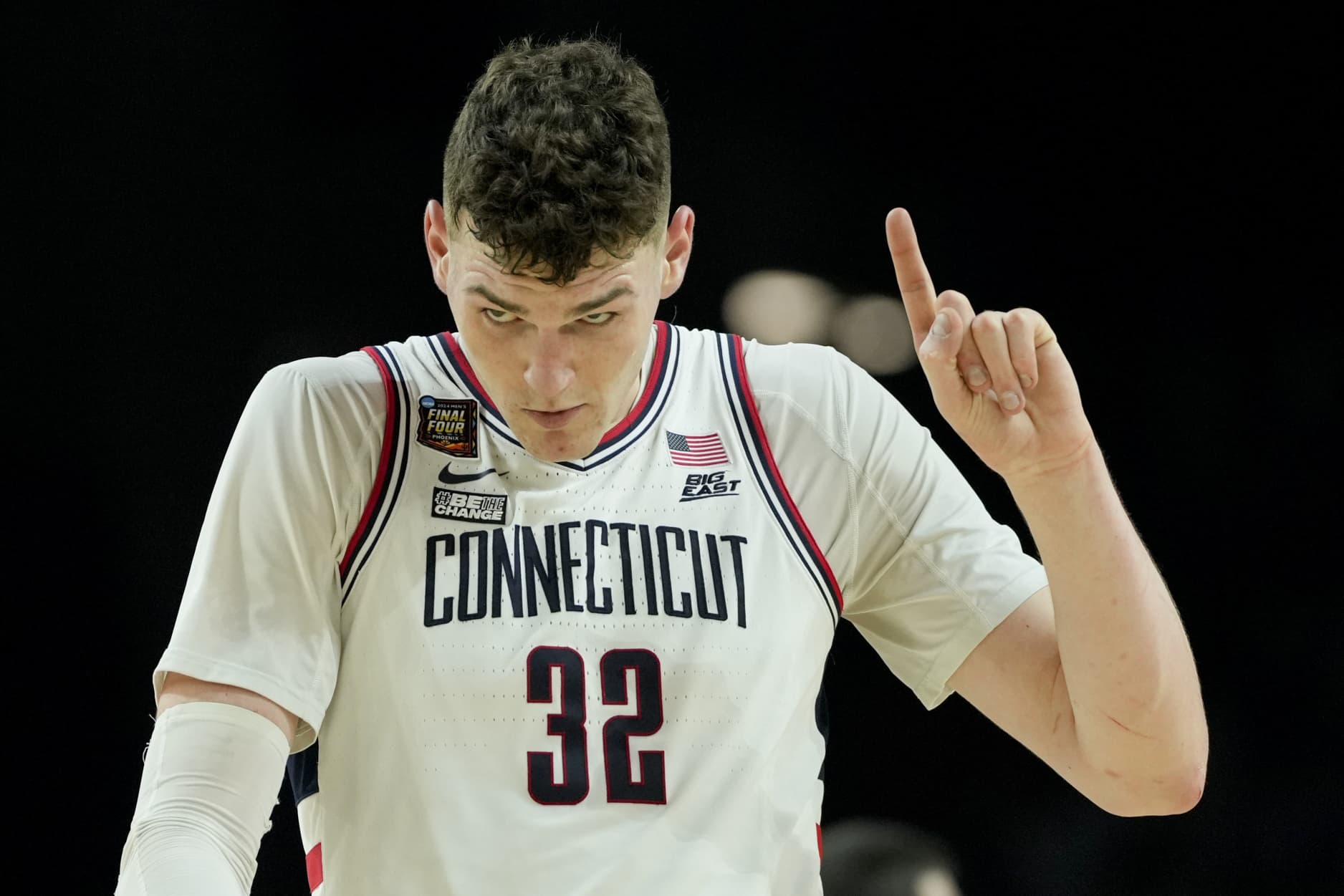 UConn center Donovan Clingan (32) celebrates after their win against Alabama in a NCAA college basketball game at the Final Four, Saturday, April 6, 2024, in Glendale, Ariz. 