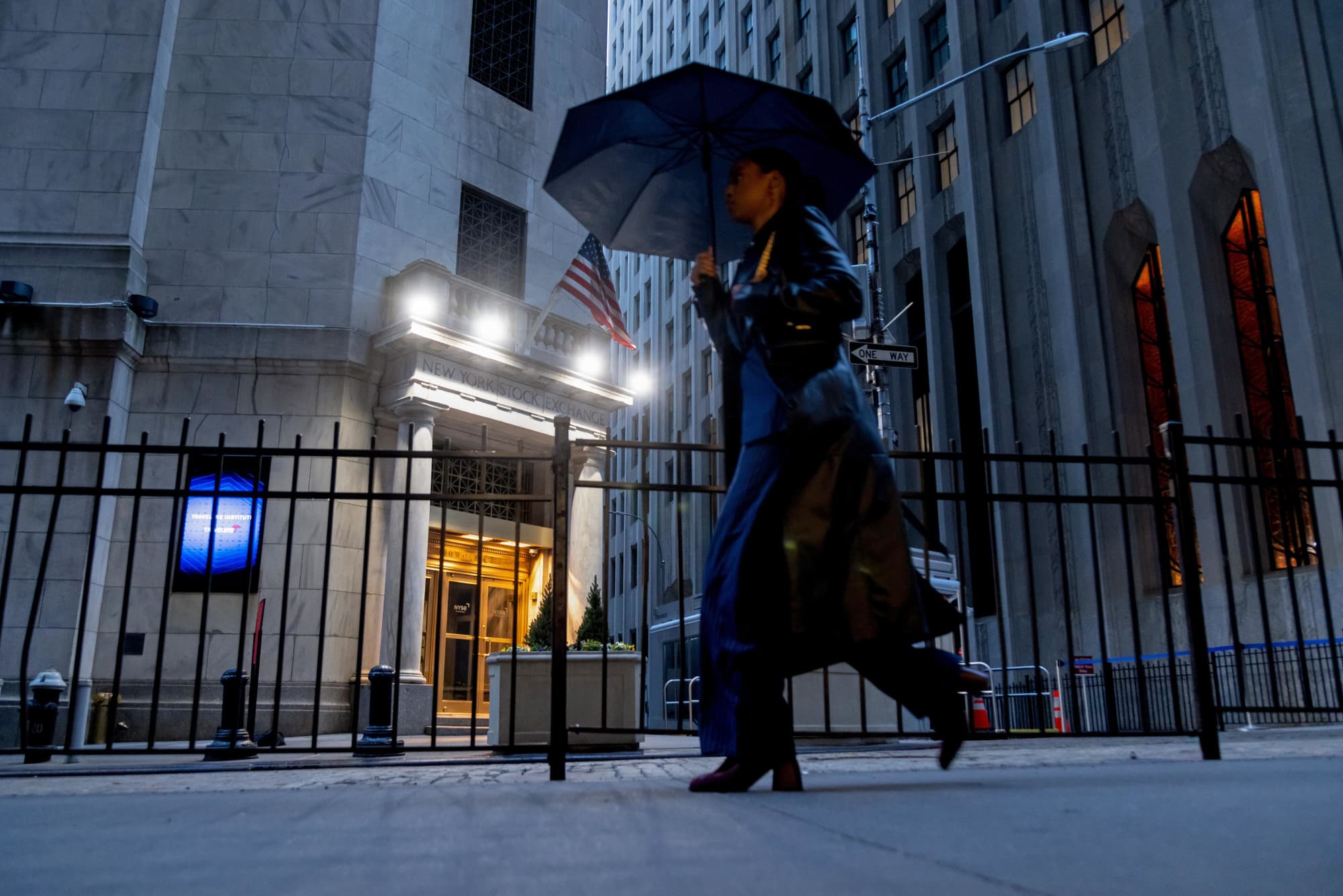 A pedestrian passes the New York Stock Exchange on Monday morning, April 7, 2025.