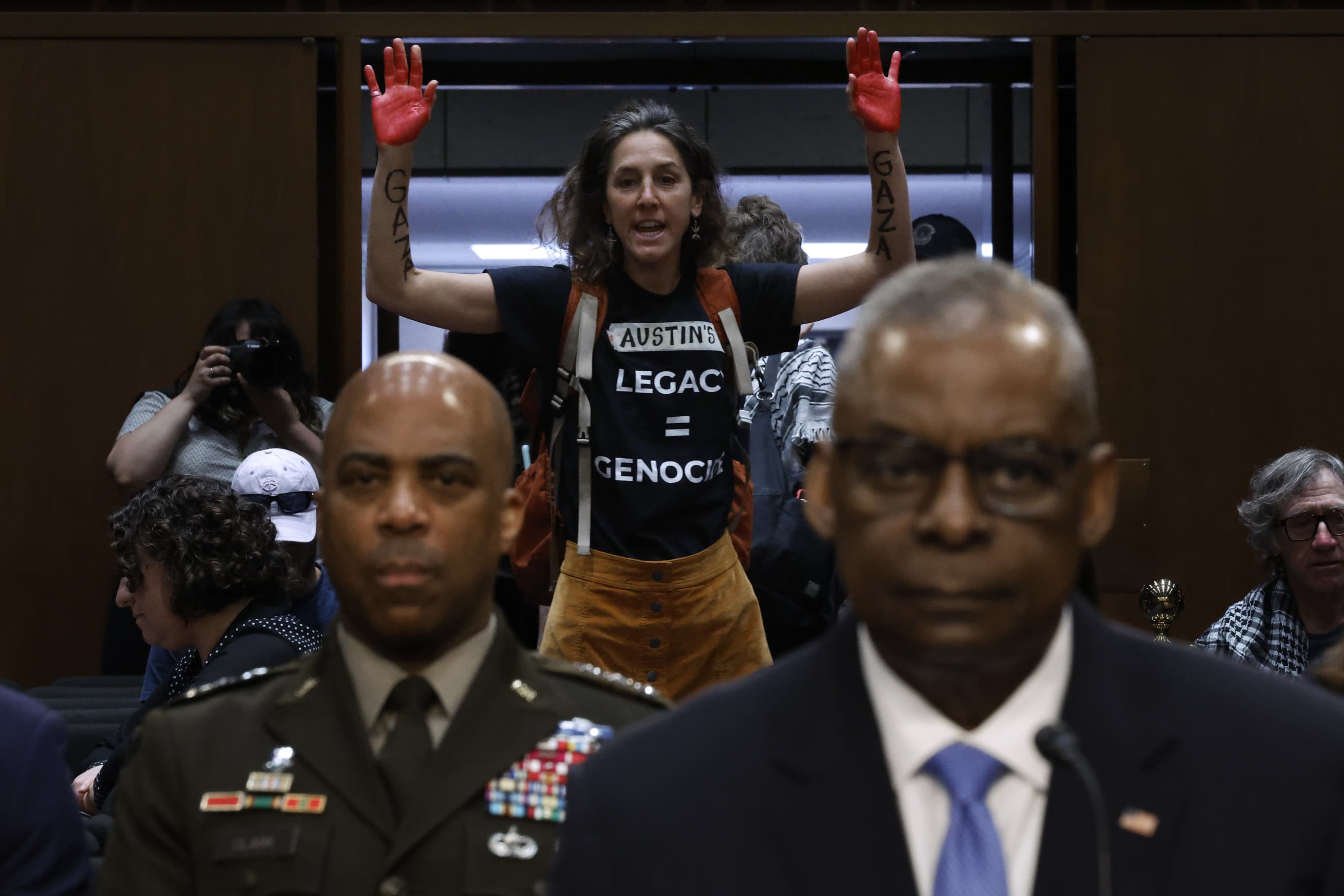 Protesters interrupt Defense Secretary Lloyd Austin as he testifies before the Senate Armed Services Committee on April 9, 2024.