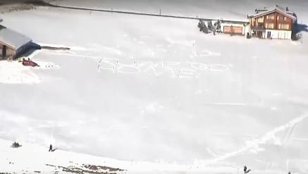 A message in the snow reads "Trump Go Home" as President Donald Trump arrives in Davos, Switzerland, on Jan. 21, 2026.