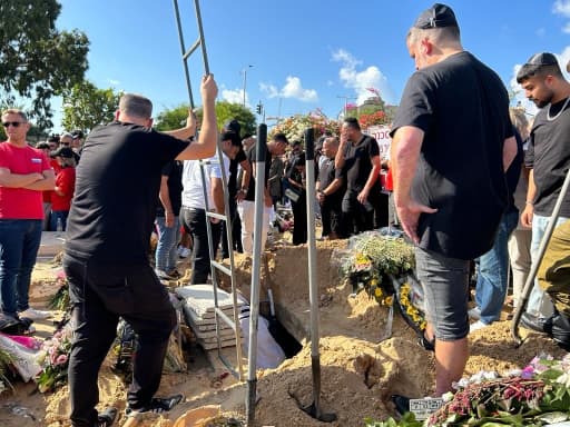 Attendees gather at Holon cemetery for the funeral of Ofek Kimhi on Thursday, Oct. 19, 2023, in Israel.
