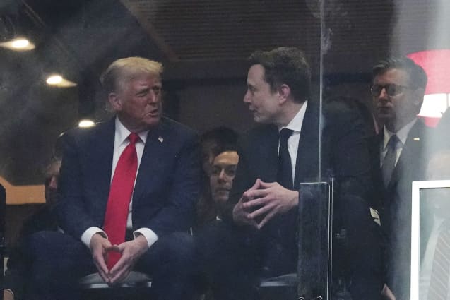 President Donald Trump and Elon Musk talk at a memorial for Charlie Kirk, Sunday, Sept. 21, 2025, at State Farm Stadium in Glendale, Ariz.